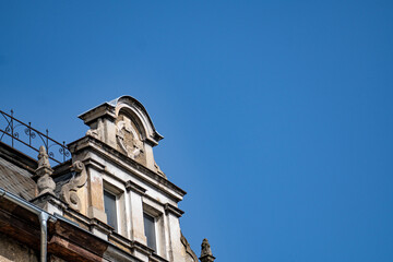 Ornate Facade Detail of a Building Against a Blue Sky
