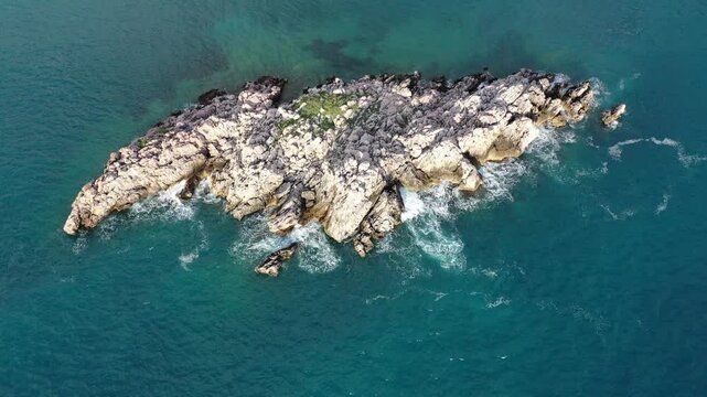 sea waves hitting the stones