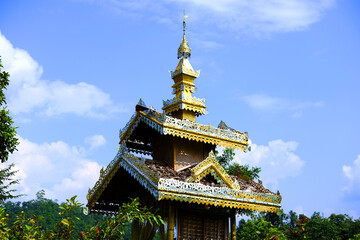 Heritage golden temple and naga on lightpole located on the mountain in the northern of Thailand