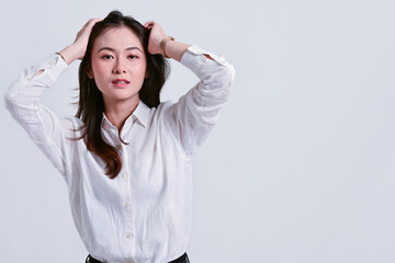 Beautiful Asian women with white shirt are charming.