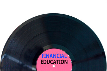 Financial education symbol. Concept words Financial education on beautiful purple black vinyl disk. Beautiful white paper background. Business Financial education concept. Copy space.