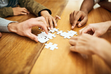 Puzzle, library and hands of students for teamwork, collaboration and working together. University,...