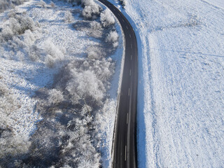 View from above of a road in the countryside with a little fog in winter 