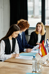 Teenagers participate in a UN Model conference, engaging in diplomatic discussions and negotiations.