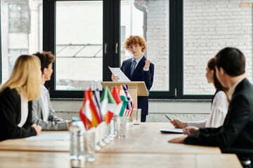 Teenagers participate in a UN Model conference, engaging in diplomatic discussions.