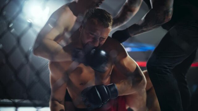Two Mixed Martial Artists Fight a High-Stakes Octagon Battle, Using Wrestling and Brazilian Jiu-Jitsu Techniques in a Thrilling MMA Battle. Fighter Securing a Fast Submission Win