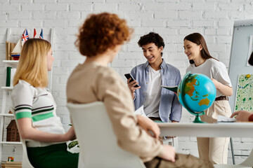Teenagers participate in a UN Model, engaging in animated conversation and displaying a globe.