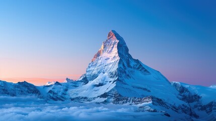 Stunning view of the snow-capped Matterhorn mountain against a clear blue sky at sunrise. Switzerland's iconic peak in winter season.