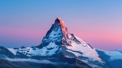 Stunning view of the Matterhorn mountain peak at sunrise with a clear sky and breathtaking landscape in the Alps.