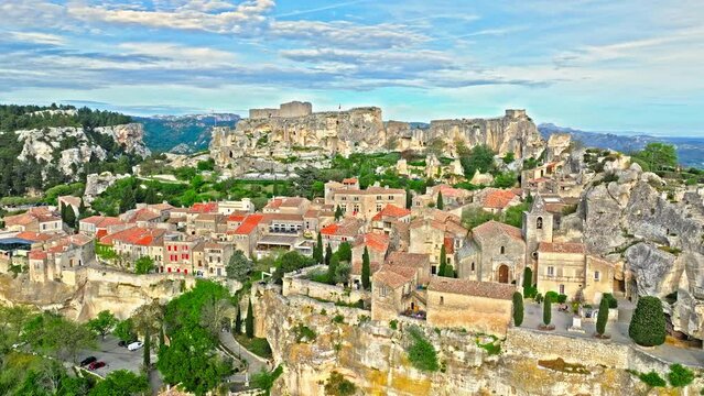 Aerial view of Medieval fortress ruins with replica siege engines in France. Les Baux de Provence village is on the rock formation, and its castle Ch&acirc;teau des Baux-de-Provence in France.