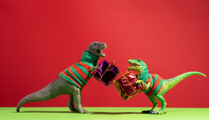 Cute dinosaurs give each other gifts on red and green background.