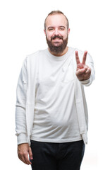 Young caucasian hipster man wearing sport clothes over isolated background smiling with happy face winking at the camera doing victory sign. Number two.