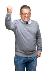 Fototapeta premium Middle age bussines arab man wearing glasses over isolated background angry and mad raising fist frustrated and furious while shouting with anger. Rage and aggressive concept.