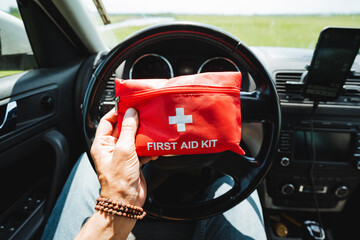 Fototapeta premium Its crucial to keep a first aid kit in your car for safety while driving, especially for long road journeys and unexpected situations. Be prepared in advance for any emergencies