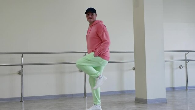 Dance fast steps, creative dance of a young guy quickstep in the studio