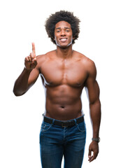 Fototapeta premium Afro american shirtless man showing nude body over isolated background showing and pointing up with finger number one while smiling confident and happy.