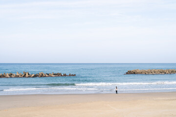 Person alone on the beach.