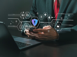 User using mobile phone and laptop computer with privacy security and data encryption system, secure internet access. Cybersecurity software technology