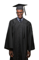 Young graduated african american man over isolated background winking looking at the camera with sexy expression, cheerful and happy face.