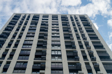 Fototapeta premium Vertical wall of a multi-story building
