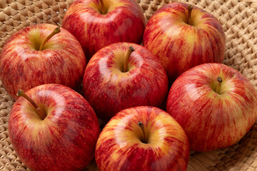  Fresh ripe sweet Royal Gala apple  in a basket close up