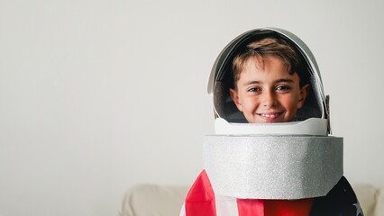 Child wearing astronaut helmet looking at camera. Presidential elections concept © Vane Nunes