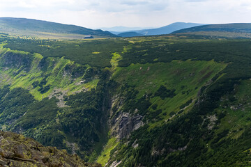Naklejka premium Mountain green landscape on a sunny summer day. Hiking and traveling. Walking in the fresh air. High quality photo