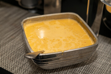 Cheese dip in a silver serving bowl 