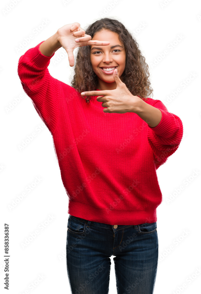 Poster young hispanic woman wearing red sweater smiling making frame with hands and fingers with happy face