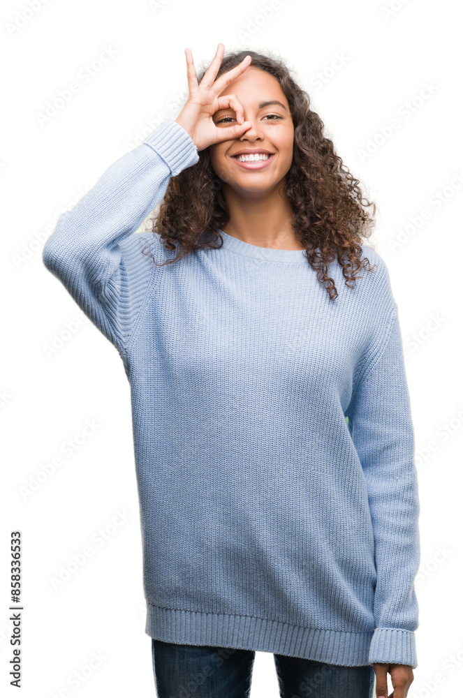 Canvas Prints Beautiful young hispanic woman with happy face smiling doing ok sign with hand on eye looking through fingers