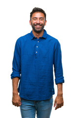 Fototapeta premium Adult hispanic man over isolated background with a happy and cool smile on face. Lucky person.