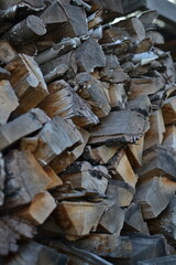 Old chopped firewood preparing for winter in the village