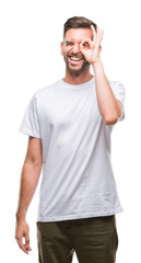 Obraz premium Young handsome man over isolated background doing ok gesture with hand smiling, eye looking through fingers with happy face.
