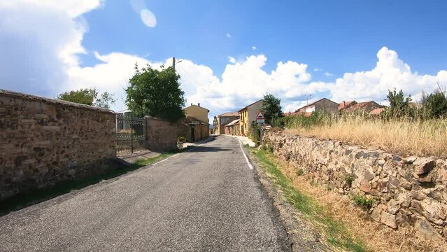 French Way of Saint James - a paved road entering El Ganso village, municipality of Brazuelo, region of Maragateria, province of Leon, Castile and Leon, Spain