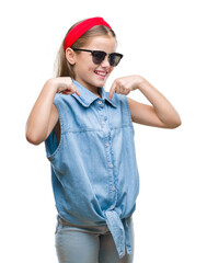 Young beautiful girl wearing sunglasses over isolated background looking confident with smile on face, pointing oneself with fingers proud and happy.