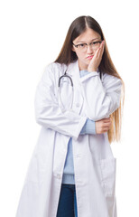 Young Chinese doctor woman over isolated background thinking looking tired and bored with depression problems with crossed arms.