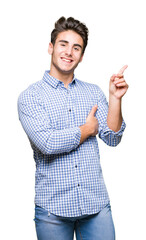 Young handsome business man over isolated background with a big smile on face, pointing with hand and finger to the side looking at the camera.