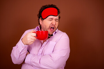 Early morning fresh gossip. Funny fat man drinking coffee. Brown background.