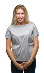 Fototapeta premium Young caucasian woman over isolated background sticking tongue out happy with funny expression. Emotion concept.