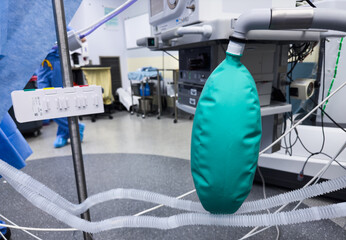 modern hospital anesthesia machine with airway ventilation system, featuring digital screens and various tubes, set in a clean and well-lit surgical room, ready for patient care