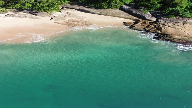 Waves crashing on the paradisiacal beach