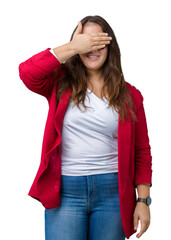 Beautiful plus size young business woman wearing elegant jacket and glasses over isolated background smiling and laughing with hand on face covering eyes for surprise. Blind concept.