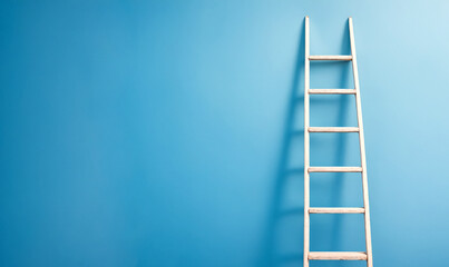 White ladder leaning against a blue wall with copy space