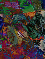 Artist's palette, palette knife painting. Abstract background with many different colors and paint stains