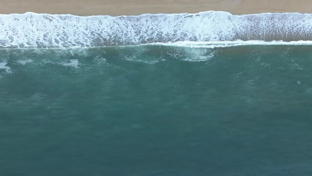 Waves crashing on the paradisiacal beach