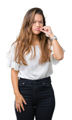 Young beautiful brunette business woman over isolated background mouth and lips shut as zip with...