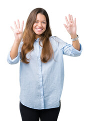 Young beautiful brunette business woman over isolated background showing and pointing up with fingers number nine while smiling confident and happy.