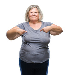 Senior plus size caucasian woman over isolated background looking confident with smile on face, pointing oneself with fingers proud and happy.