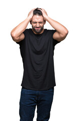 Fototapeta premium Young handsome man over isolated background suffering from headache desperate and stressed because pain and migraine. Hands on head.