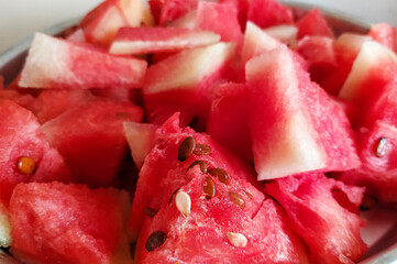 Slices of watermelon in a plate, fruit photography, ripe melon, healthy food background 